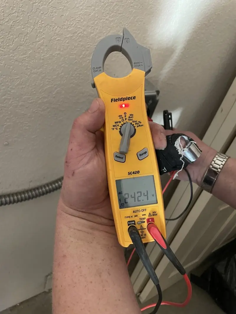 Voltage testing with clamp meter during Outlet Installation in West Boylston